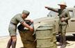 Oil drum close-up with German troops in North Africa